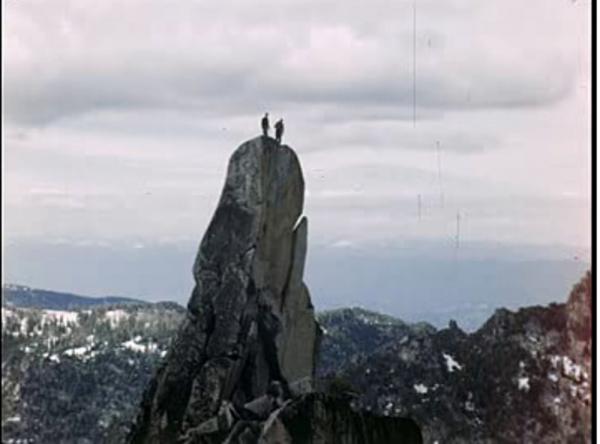 Two people on standing on a tower